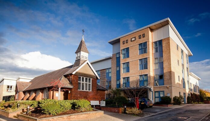 University Halls with a church in front of it.
