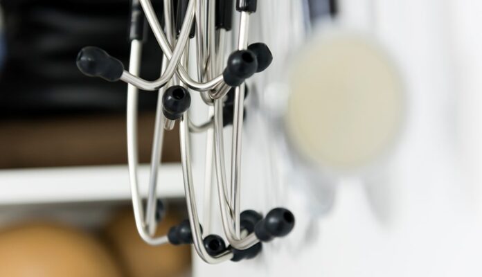 A stethoscope hanging on a wall.